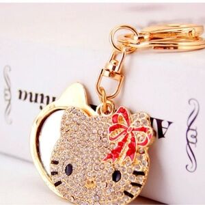 Hello kitty gold mirror charm keychain. NWT